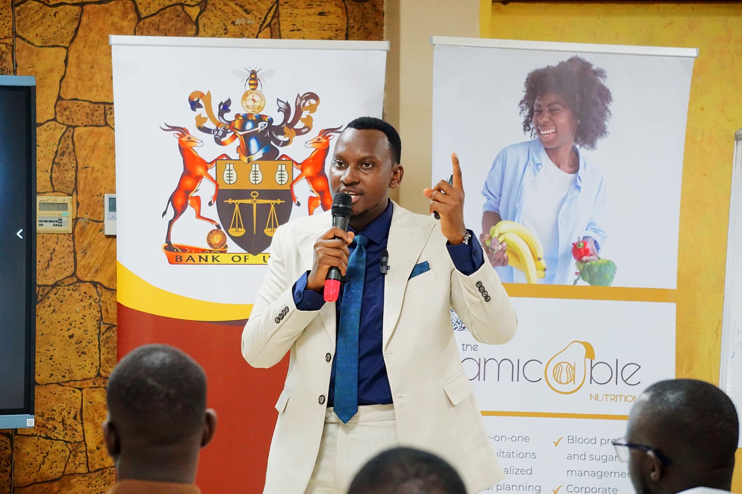 Ivan speaking on stage at a corporate wellness event